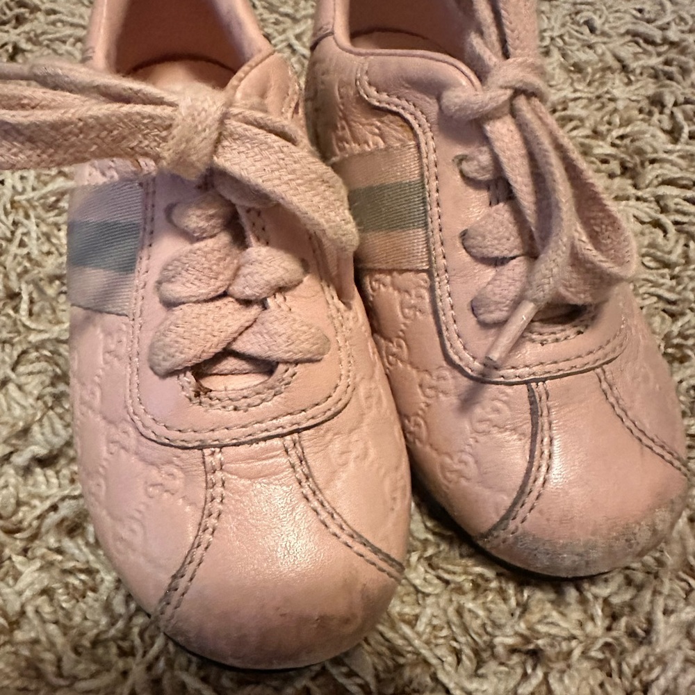 Toddler Gucci pink shoes size 22 fit like 5-6 .Show wear on the top like pics.
